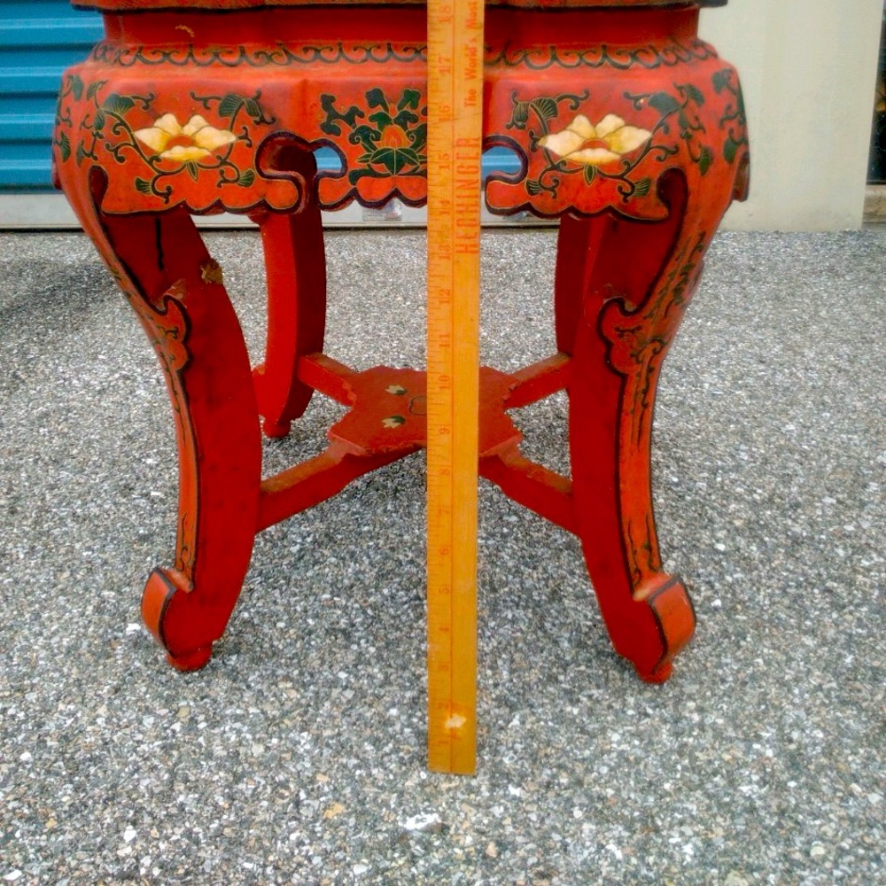 Antique red lacquer table hand carved and painted with exquisite detail.